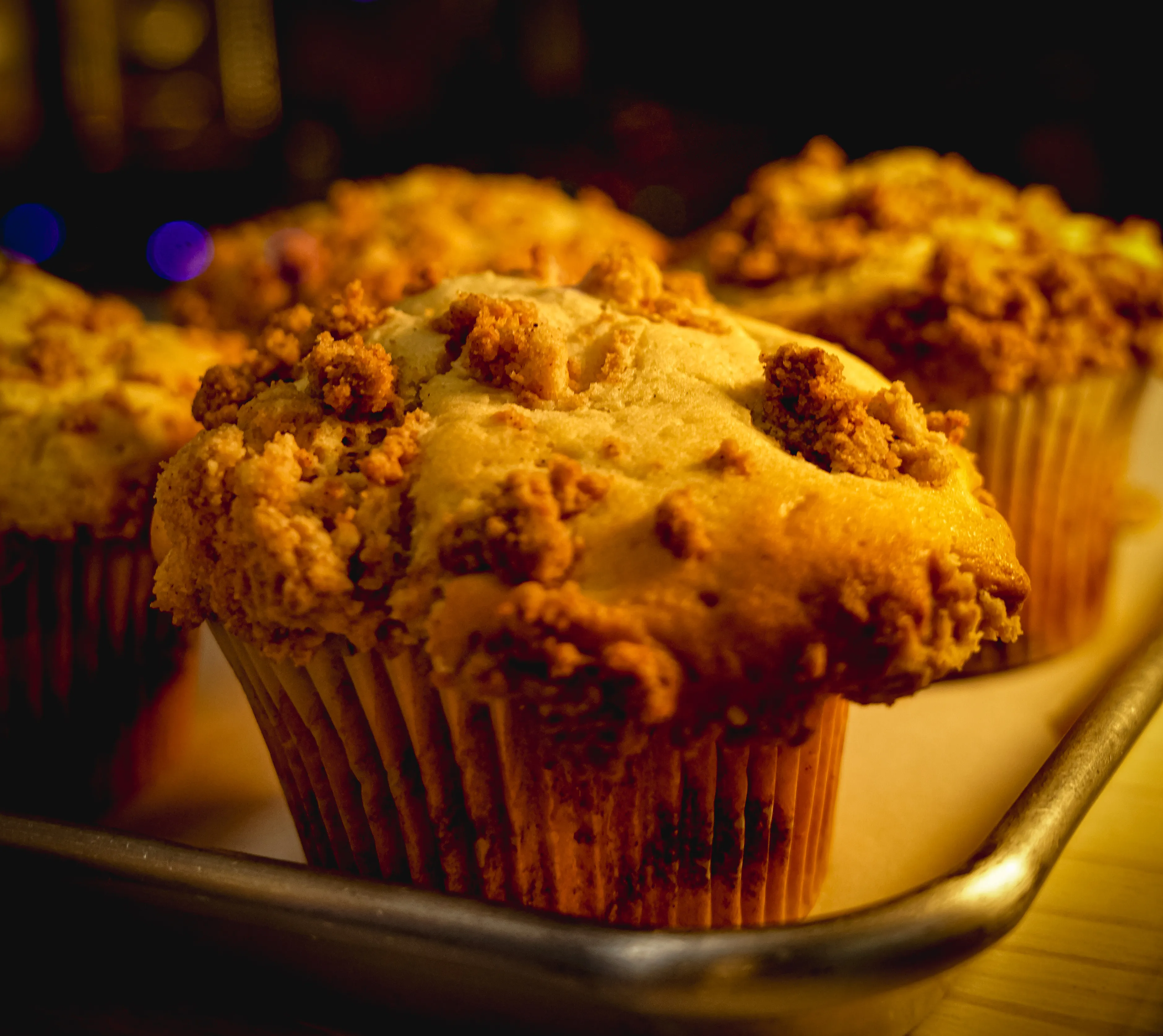 Coffee cake muffins with golden-brown crumb topping