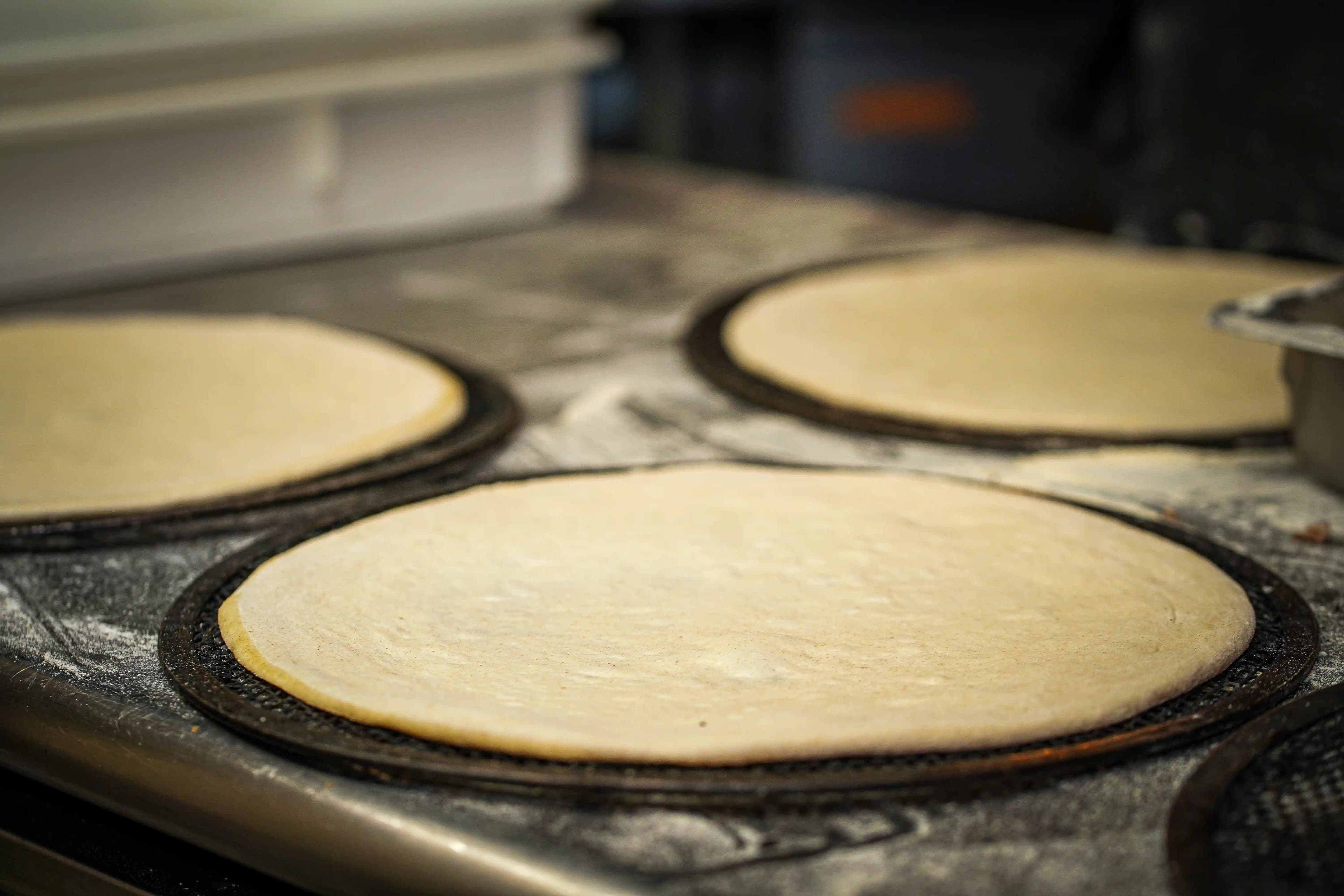 Pizza doughs on a table